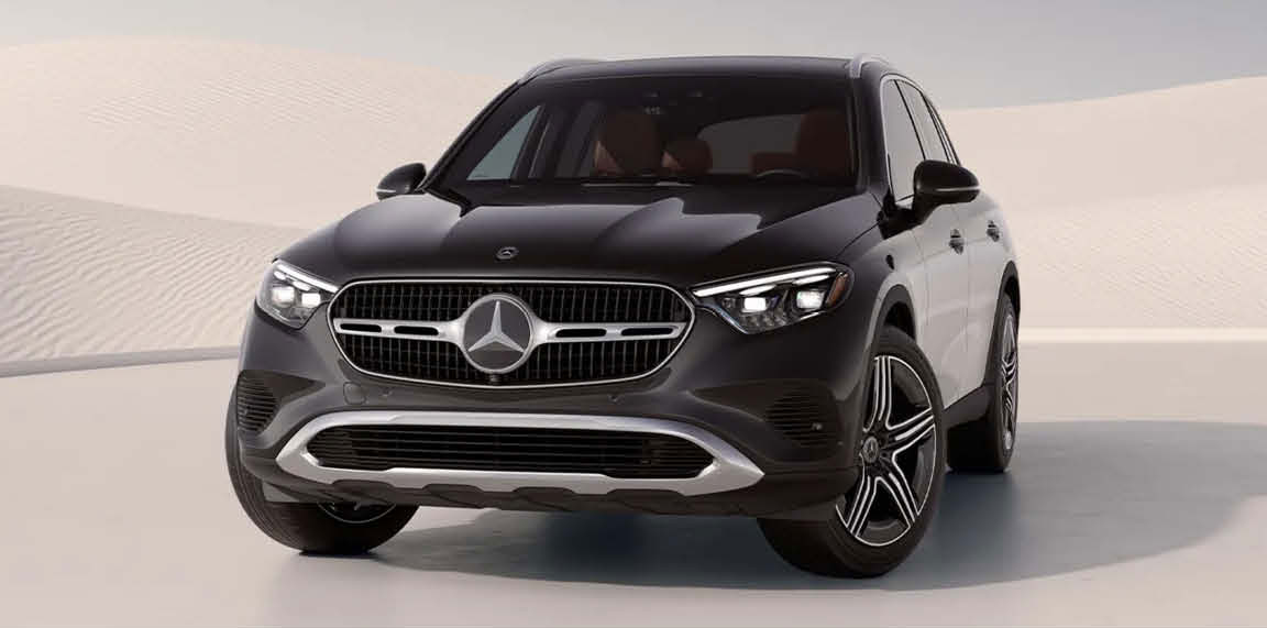 black Mercedes-Benz luxury SUV parked in minimalist desert-inspired setting