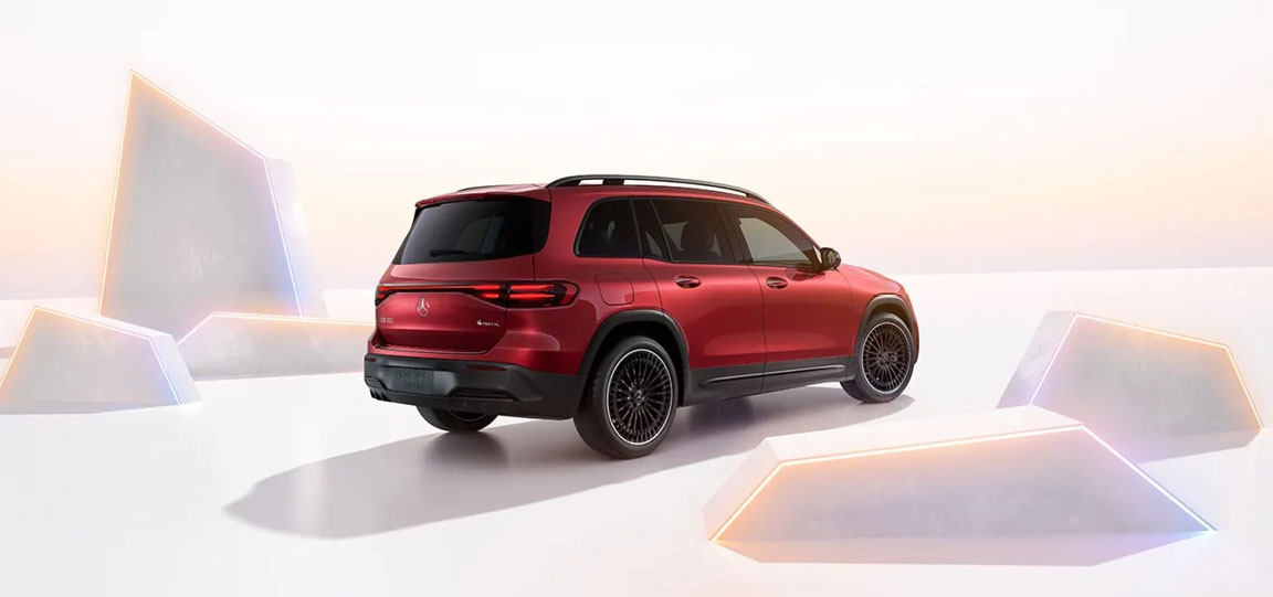rear view of red Mercedes-Benz electric SUV in futuristic studio setting