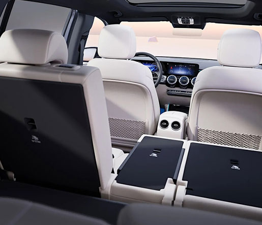 Mercedes-Benz SUV interior showing cargo space and folded rear seats