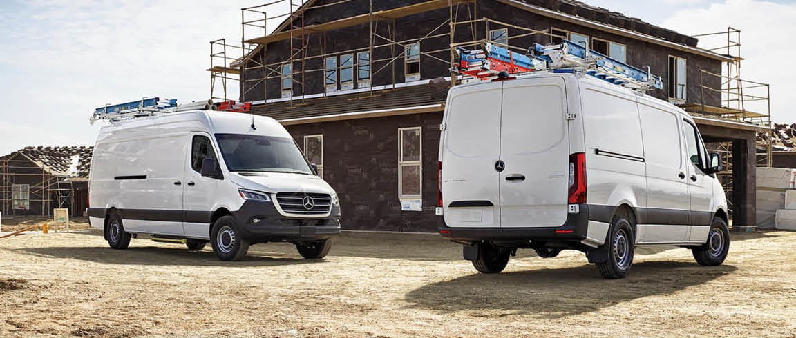 Mercedes-Benz Sprinter cargo vans at a construction site for commercial work