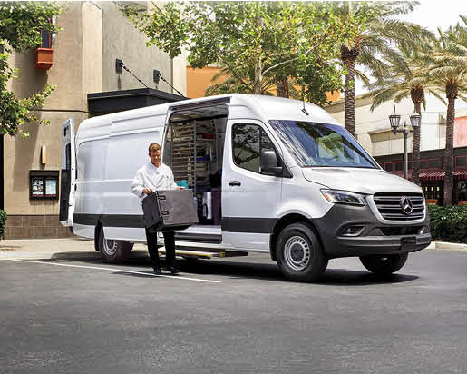 Business owner unloading equipment from a Mercedes-Benz Sprinter cargo van