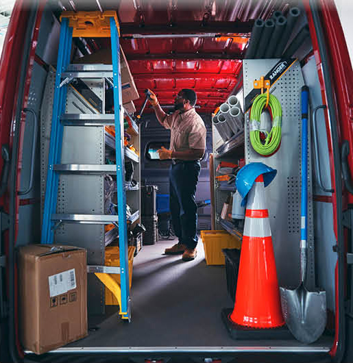 Organized interior shelving and tools inside a professional service van