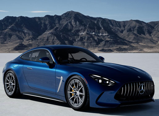 Blue Mercedes-AMG GT sports coupe parked on an open landscape