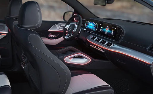 Mercedes-Benz GLE cabin with ambient lighting, digital displays, and premium seating materials