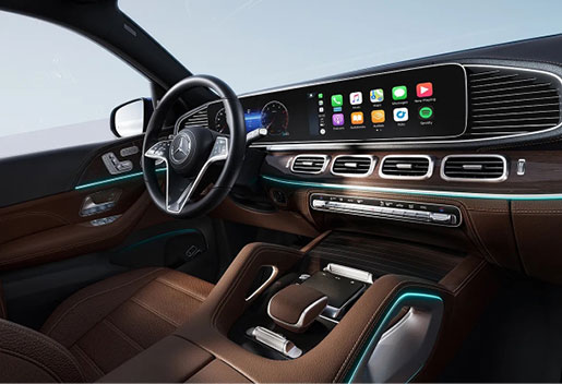 Mercedes-Benz GLE interior featuring widescreen infotainment display, premium materials, and ambient lighting