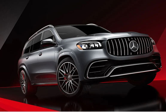 silver Mercedes-AMG luxury SUV in dramatic studio lighting