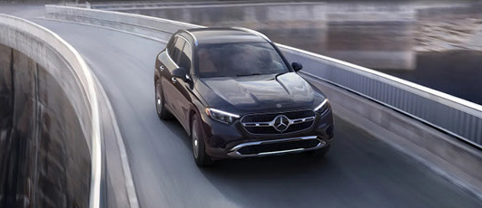 Mercedes-Benz GLC SUV driving on a modern elevated highway