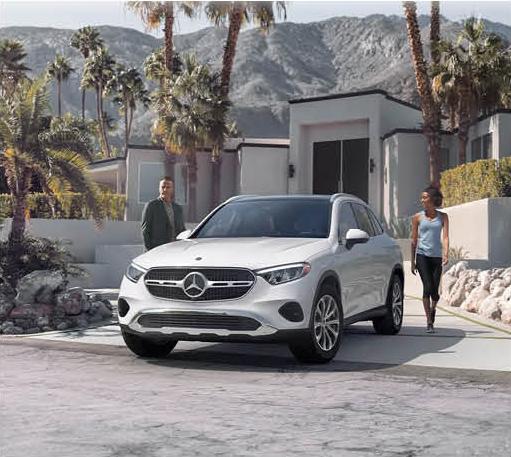 Mercedes-Benz GLC SUV parked in front of a modern luxury home