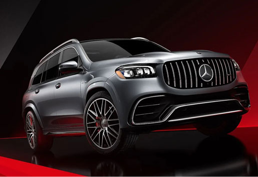Mercedes-AMG GLS SUV with Panamericana grille on a black and red studio background highlighting high-performance luxury styling.