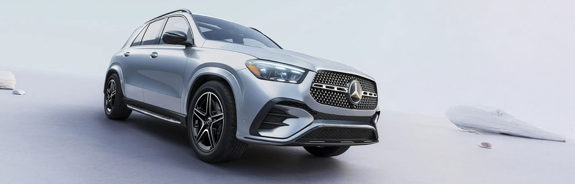 Mercedes-Benz GLE SUV in a bright studio setting highlighting luxury exterior styling and diamond grille design.