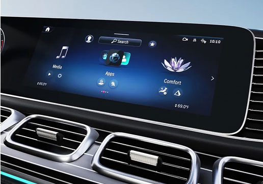 Mercedes-Benz MBUX infotainment display with widescreen digital touchscreen, media, apps and comfort controls.
