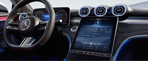 Mercedes-Benz MBUX infotainment system with ambient lighting, digital connectivity, voice controls, and advanced driver technology