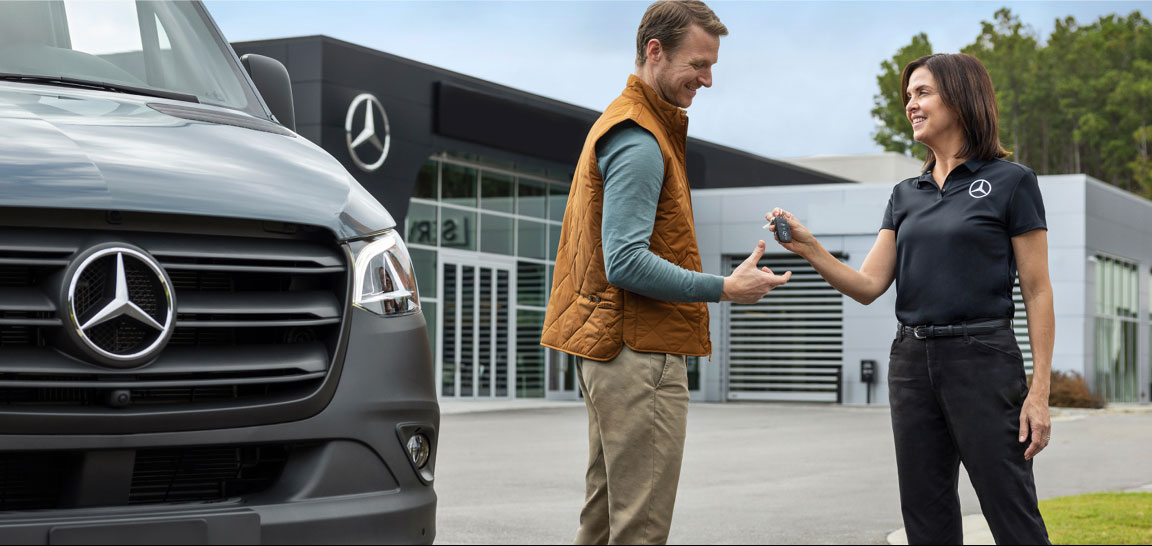 Customer receiving keys for a Mercedes-Benz Sprinter, representing a seamless commercial vehicle purchasing experience and dealership support