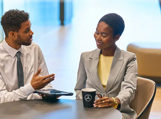 two coworkers having a conversation