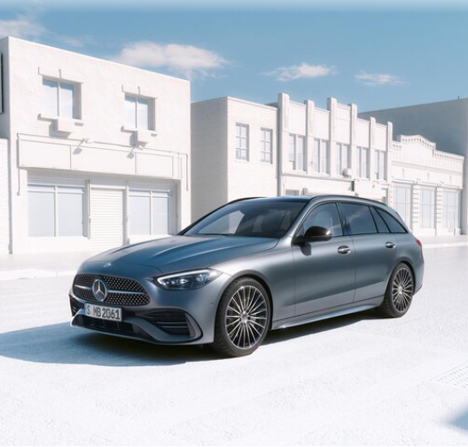 Mercedes-Benz vehicle wagon driving through bright city street