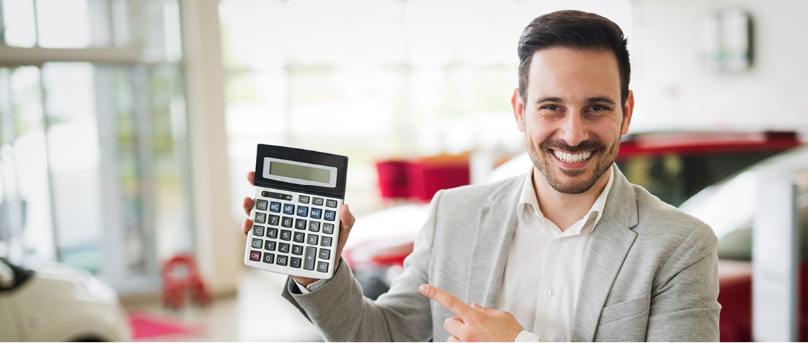 a man holding a calculator