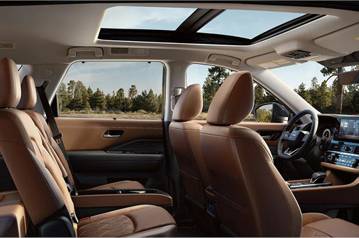 Nissan Pathfinder interior with panoramic moonroof emphasizing an open, airy cabin experience and premium comfort