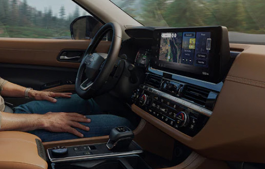 Nissan Pathfinder interior displaying a modern dashboard layout, digital technology, and premium cabin finishes