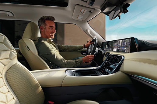 Nissan Armada interior with driver and large touchscreen infotainment system