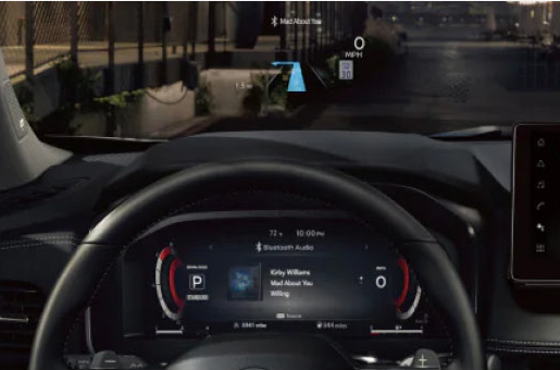 driver's view of Nissan Rogue interior featuring head-up display and digital instrument panel