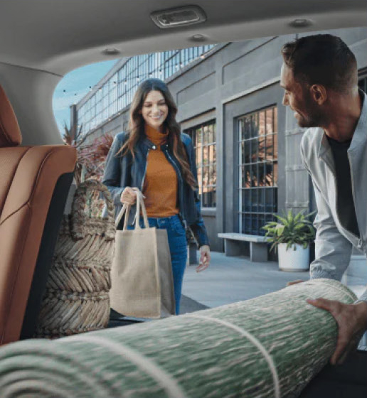 Nissan Rogue cargo area loaded with shopping bags and household items for everyday versatility