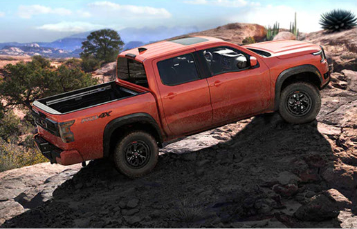 Nissan Frontier PRO-4X climbing rocky terrain demonstrating impressive off-road capability, traction, and ground clearance