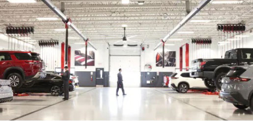 Nissan service bays with vehicles being serviced