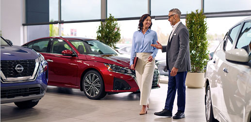 Customer speaking with a Nissan dealership representative