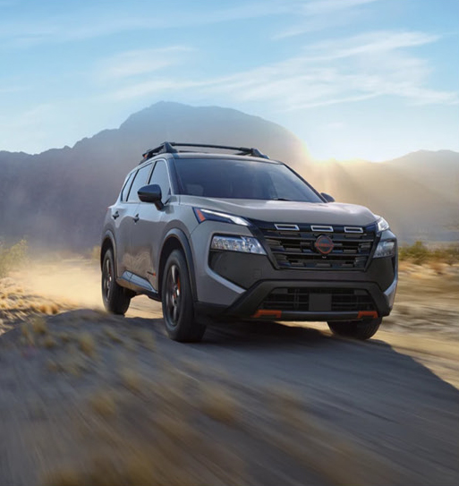 Nissan Rogue Rock Creek SUV driving off-road on dusty trail