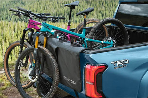 Toyota Tacoma TRD Sport truck bed with mountain bikes and outdoor gear loaded
