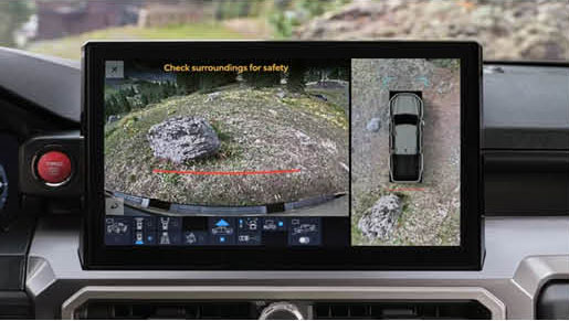 Toyota Tacoma surround view camera display showing off road terrain and parking assist