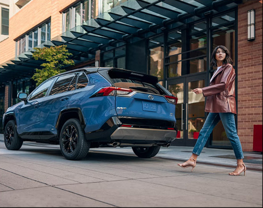 Toyota RAV4 parked outside a modern building in an urban setting