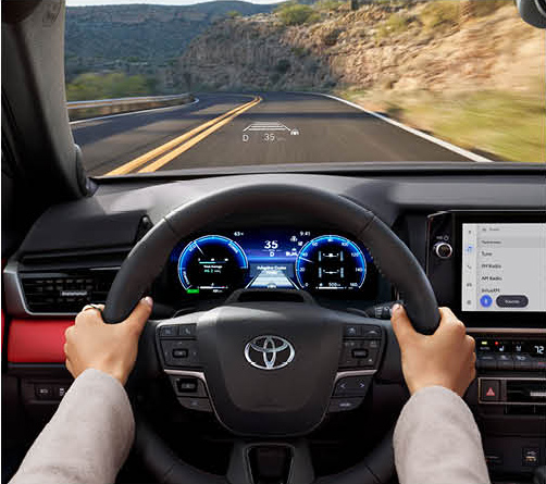 Toyota vehicle interior showing digital driver display and head-up driving information system