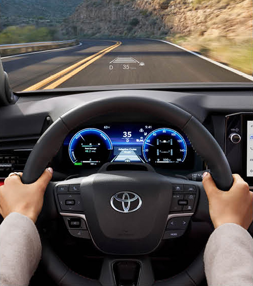 Toyota Camry interior showing digital driver display and head-up display technology