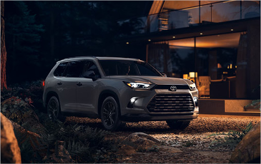 Toyota Grand Highlander parked outside a luxury home at night highlighting premium SUV styling