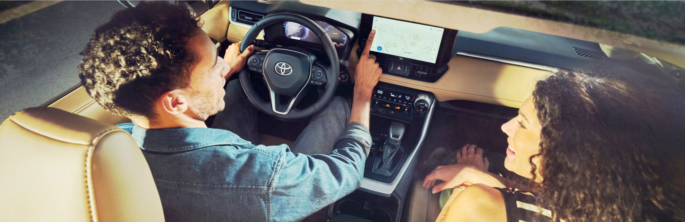 a couple having a conversation inside a Toyota vehicle