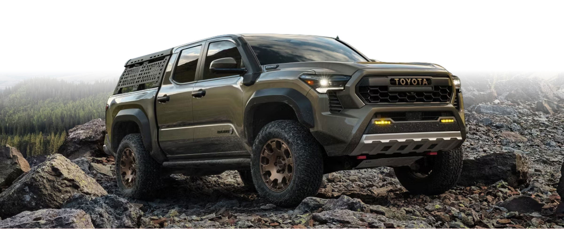 a Toyota Tacoma on a rocky mountain