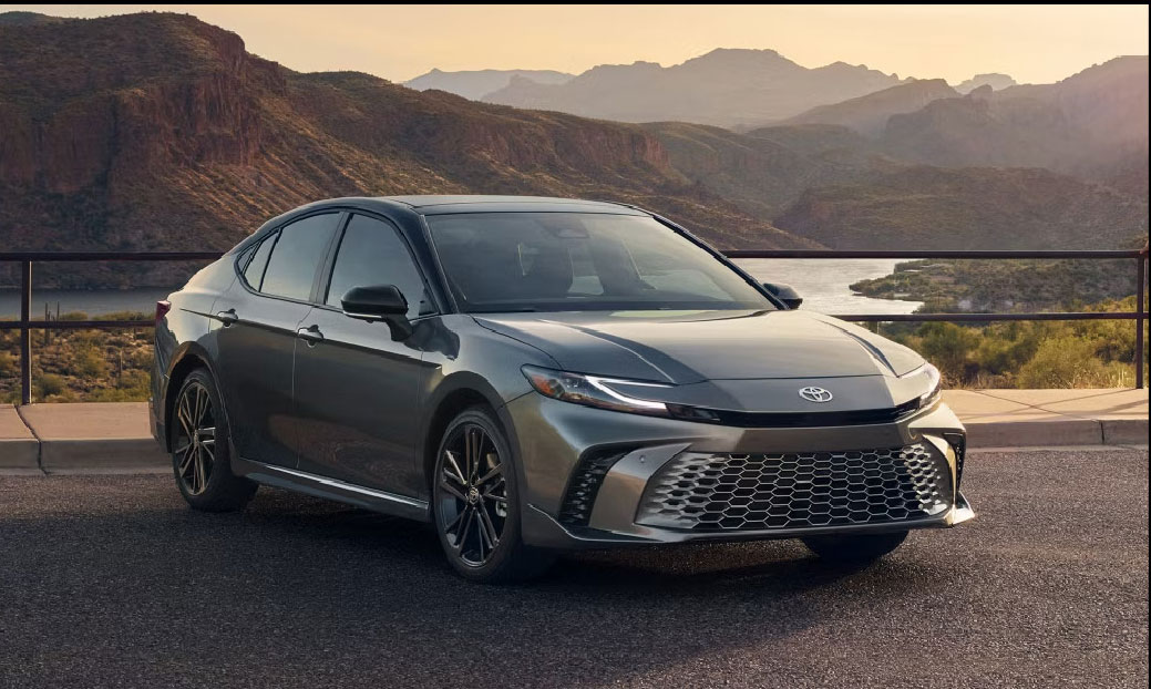 Toyota Avalon parked by scenic mountain lake overlook