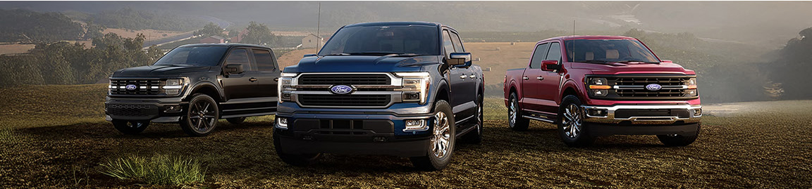 Ford F-150 truck lineup showcasing multiple trims in outdoor setting