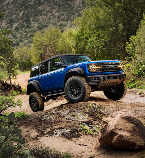 Ford Bronco SUV rock crawling on rugged trail terrain