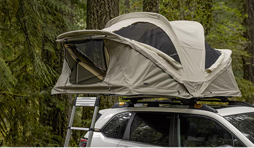 Roof top tent mounted on a Subaru SUV for outdoor camping adventures