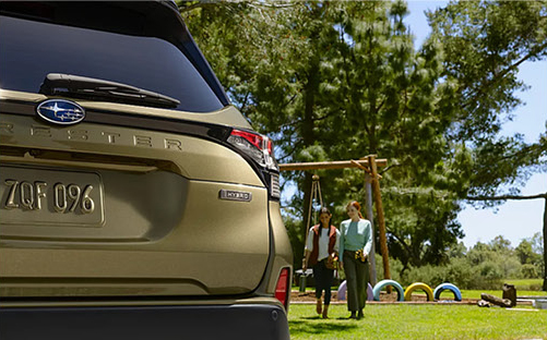 Rear view of Subaru Forester Hybrid parked near a playground