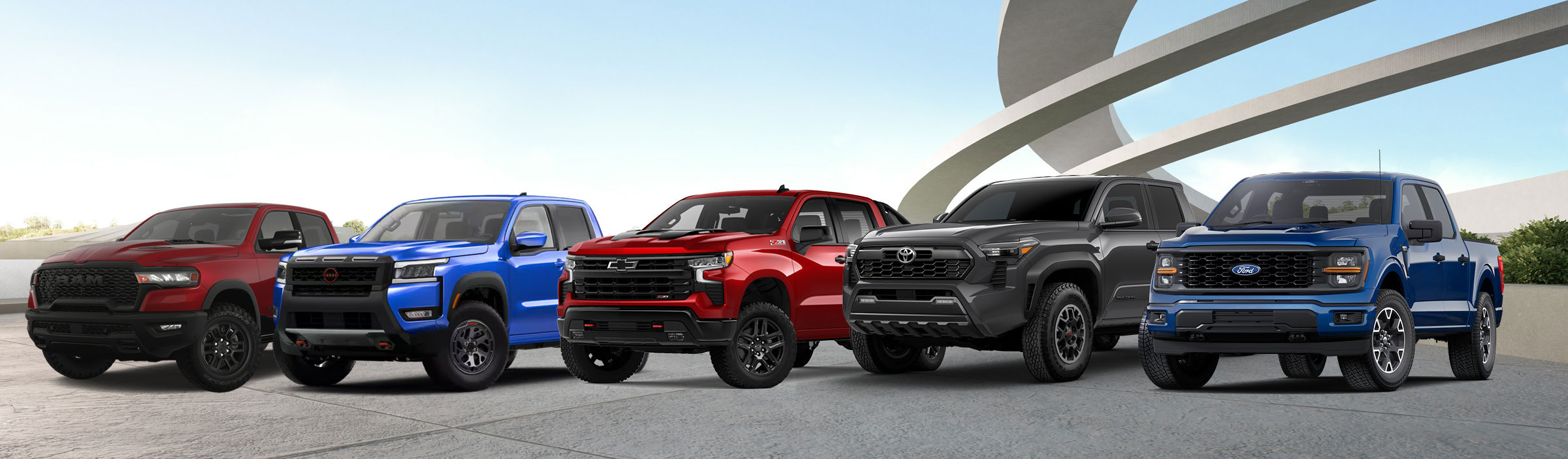 Lineup of pickup trucks from multiple brands parked outdoors