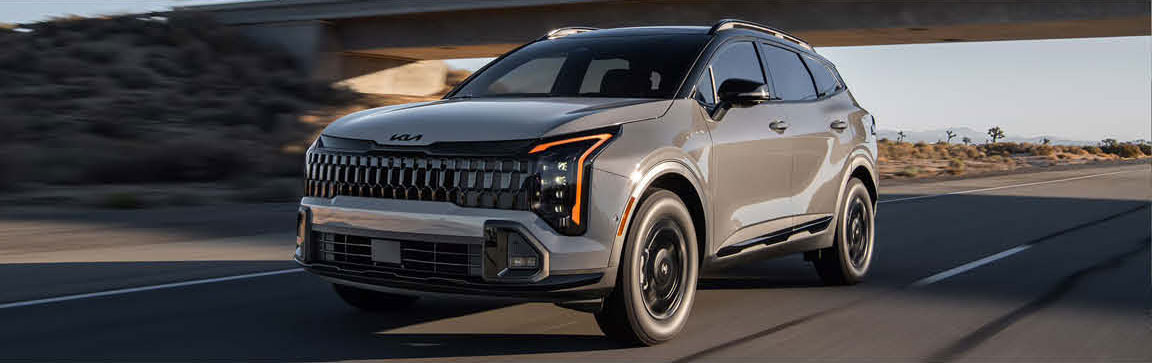 Kia Sportage SUV driving on highway at speed