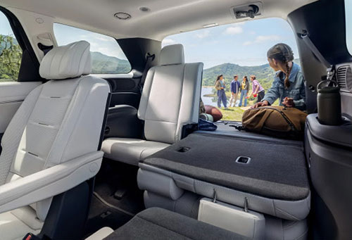 Honda Pilot interior with folded seats showing spacious cargo area for road trips