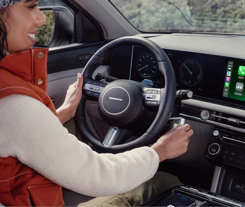 Hyundai Tucson interior featuring a digital instrument cluster, intuitive controls, and advanced connected technology for everyday convenience