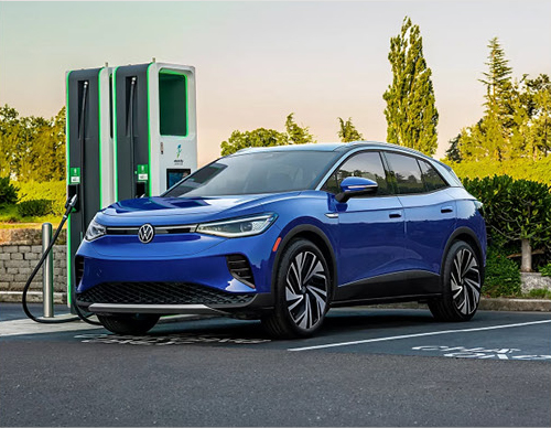 Volkswagen ID.4 electric SUV parked at a public EV charging station