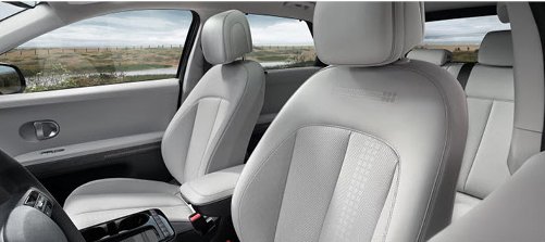 Hyundai IONIQ 5 interior featuring spacious front seats and modern cabin design