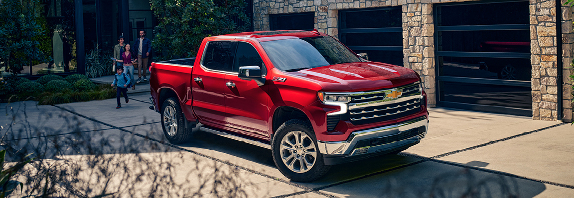 2025 Chevy Silverado 1500 driving on backroads.