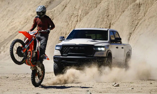 A RAM 1500 and a Dirt bike racing off-road